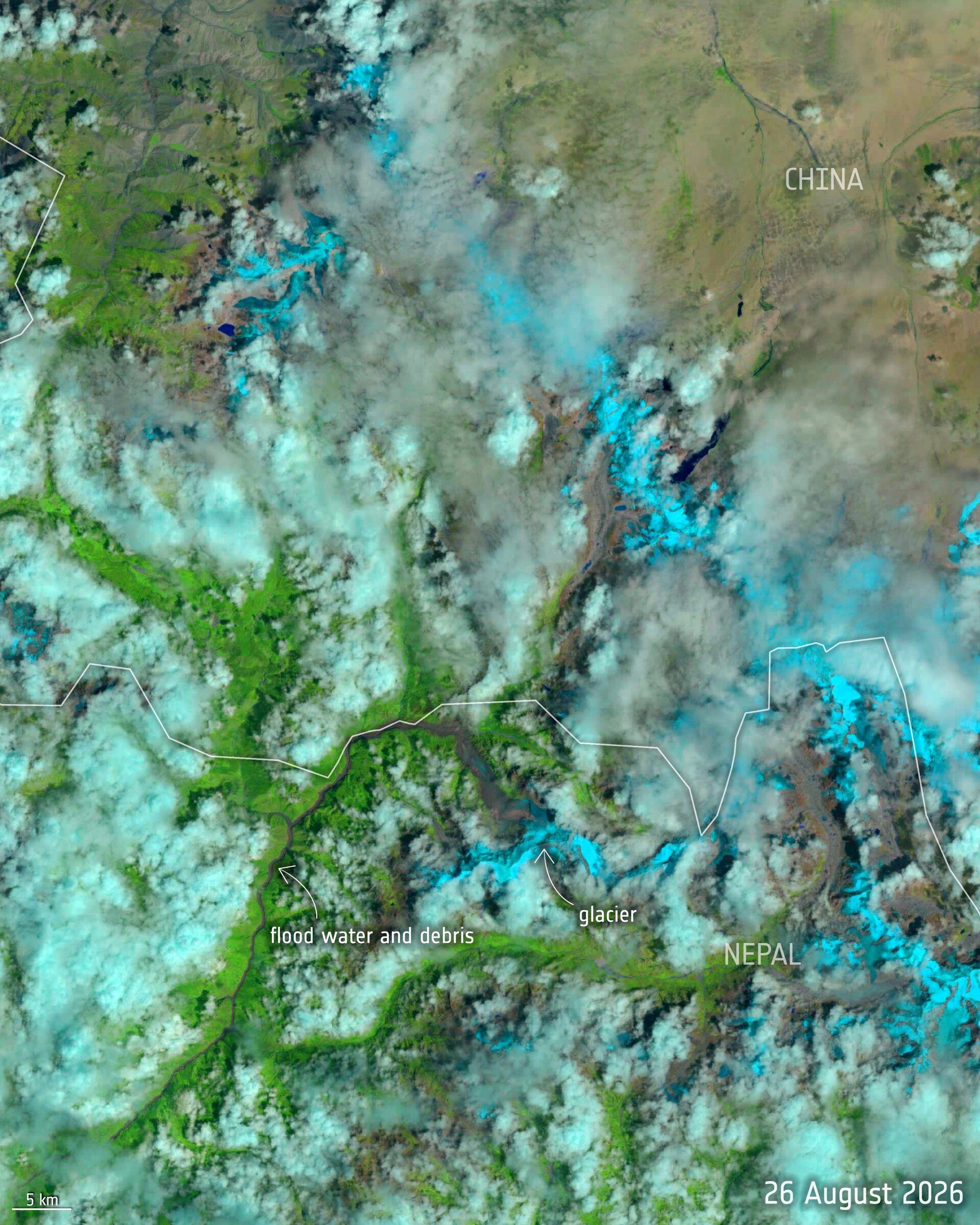 Satellite image of the same Himalayan valley on the day of the flood, showing the changed river course.